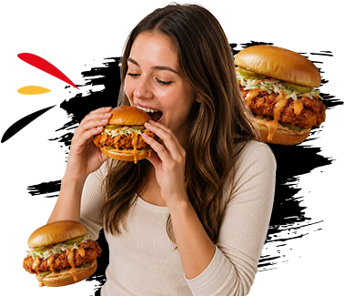 Woman taking a big bite of a crispy chicken sandwich